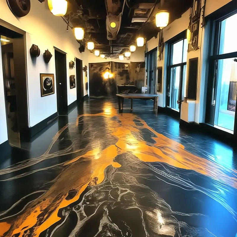Black and gold metallic epoxy flooring with a marbleized, high-gloss finish.