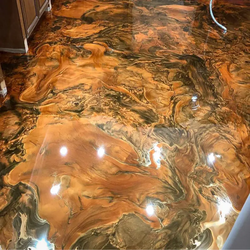 Glossy bronze and copper metallic epoxy flooring with deep marbleized swirls.