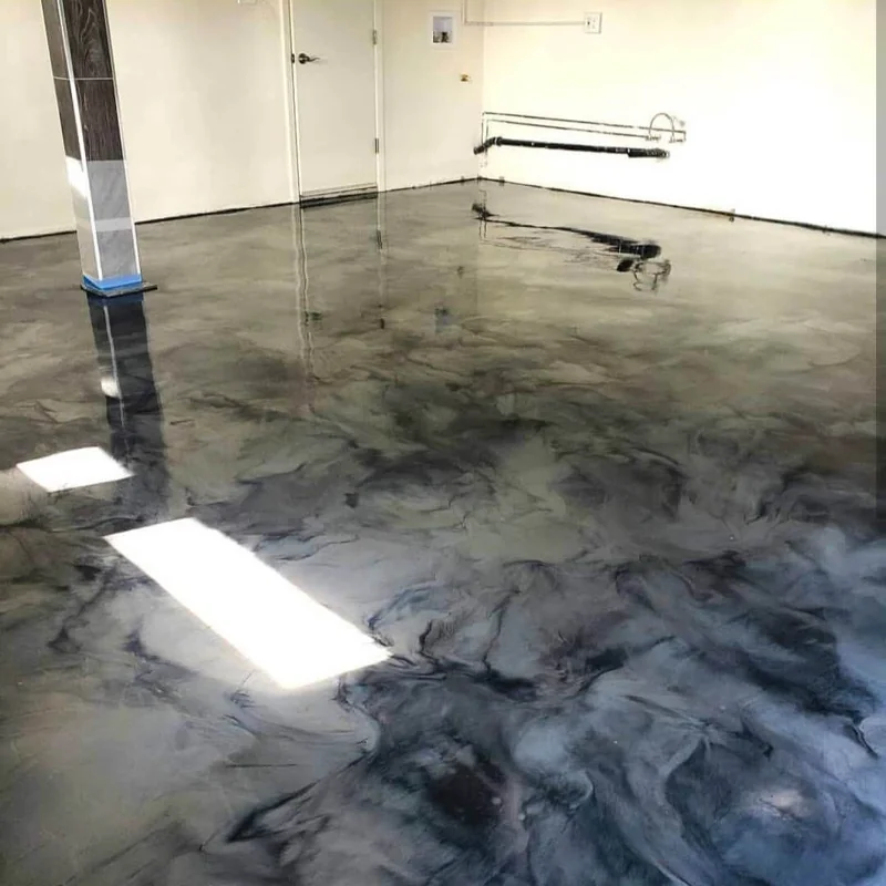 High-gloss gunmetal grey and silver metallic epoxy flooring in a clean garage.
